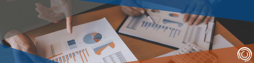 2 people looking over documents to determine the valuation of a business for active or passive appreciation. Determining the divorce valuations.